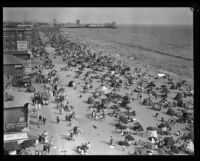 Crowd celebrating the Fourth of July on a beach near Ocean Park Pier, Santa Monica, 1929