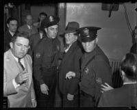 Eugene Kent, President of Glendale Protective Association, led by police, Glendale, 1935