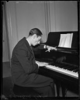 Agustín Lara, Mexican lyricist, singer and actor, seated at a piano, 1930-1939