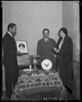 Norma Boleslavsky with actors Ivan Lebedeff and David Mir, admiring a collection of Russian artifacts, Los Angeles, 1932