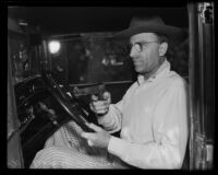 William C. Keim reenacts encounter with road bandits, Los Angeles, 1932