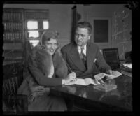 Judge Joseph P. Sproul with actress Laura Lee signing her contract, Los Angeles, 1930