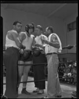 King Levinsky in the ring surrounded by Sam Levinsky, Harold Steinman, and Jerry Luvadis, Los Angeles, 1934