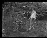 Helene Pirie shovels dirt, Los Angeles, 1926