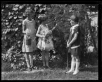 Lois Klotz admires Mariana and Dolly Wright's garden, Los Angeles, 1926