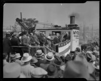 Mayor Frank L. Shaw speaks from a platform beside a steam shovel near Fort Moore Hill, Los Angeles, 1934