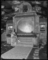 Patty Clark sitting on the Orange county exhibit at the LA County Fair, Pomona, 1934