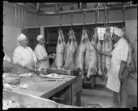 Butchers in the Los Angeles County General Hospital kitchen prepare to butcher animal carcasses, Los Angeles, [1934]