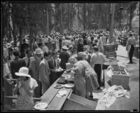 Part of a crowd of 60,000 people crowding the serving tables at the Sheriff's Relief Association barbecue, Los Angeles, 1934