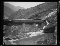 Blown-out section of pipe along the Los Angeles Aqueduct in No-Name Canyon, Inyo County vicinity, [about 1927]