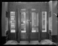 Looking outside from an entrance of the unfinished California State Building in downtown Los Angeles, early 1930s