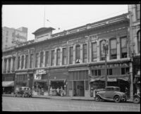 Storefronts on Spring Street between 1st and 2nd Streets in downtown Los Angeles, early 1930s