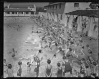 Children plunge into the reopened pool in Griffith Park, Los Angeles, 1934