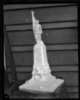 Small sculpture of a soldier on a pedestal, probably related to Pershing Square, Los Angeles, 1920s