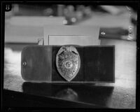 Los Angeles Police Department badge in its leather case, 1920-1939