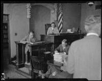 Witness looks at evidence during Aimee Semple McPherson's preliminary hearing, Los Angeles, circa 1926