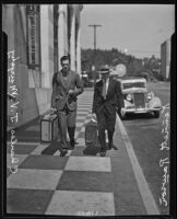 Kennett Longley Rawson and Charles John Vincent Murphy stroll down the sidewalk, Los Angeles, 1928