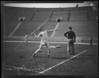 Johnny Myrra throwing a javelin at the Coliseum, Los Angeles, circa 1925
