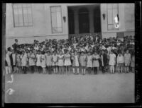 Children pose for a class picture outside of Benito Juarez elementary school (Escuela Primaria Benito Juarez), Mexicali, B.C., Mexico, 1927