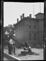 Men panning for gold in the yard of the U.S. Mint, Carson City, Nevada, 1933
