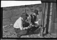 Deputy Sheriffs Ybarra and Mendoza find children's shoes during the Gordon Northcott investigation, Santa Clarita, circa 1928