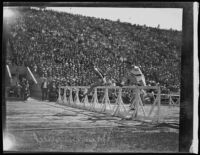 Paavo Nurmi clears a hurdle at a Coliseum track event, Los Angeles, 1925