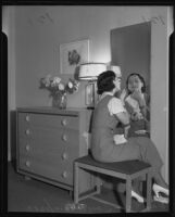 Joy Thompson at a dressing table at the National Housing Exposition, Los Angeles, 1935