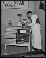 Man demonstrates an electronic range at the National Housing Exposition, Los Angeles, 1935