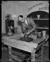Man shapes a piece of pottery at the National Housing Exposition, Los Angeles, 1935