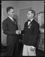A. A. Normandin and Ernest I. Kilcup, credit men, shake hands, Los Angeles, 1933