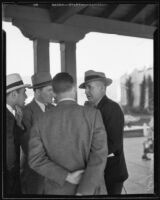 Professor Raymond T. Moley chatting with others, Los Angeles, 1933