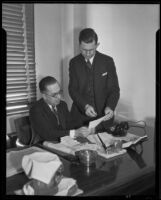 Judge Nye reviews paperwork with his predecessor, Judge Crum, Los Angeles, 1934