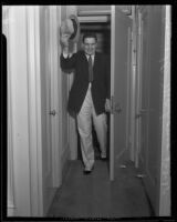 Danno O'Mahony, wrestler, enters a doorway, Los Angeles, 1935