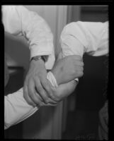 Danno O'Mahony arm wrestles with his manager, Jack McGrath, Los Angeles, 1935