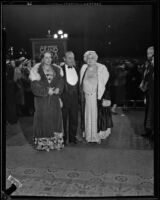 Two women and a man on opening night of the Grand Opera at the Philharmonic Auditorium, Los Angeles, 1932