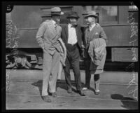 Charles Paddock and Doug Fairbanks Jr. are greeted at the train station by Paddock's father, Pasadena, 1924