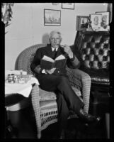 Admiral William V. Pratt reading in a wicker chair, San Pedro (Los Angeles), 1929