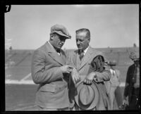 Football player Red Grange, and his manager C. C. Pyle, Los Angeles Coliseum, 1928