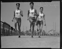 Athletes Fernando Ramos, Max Luna and Alfred Castillo running track, Los Angeles, 1933