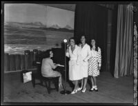 Three singing women accompanied by a pianist at the Eighth Annual National Radio Show, Los Angeles, 1930