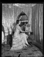 Edna Kirby turns the radio dial, Los Angeles, 1930