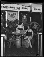 Two women at the Music & Radio Trade Journal booth at the Eighth Annual National Radio Show, Los Angeles, 1930