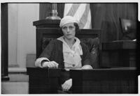 Marian Read sitting in a courtroom at her divorce proceedings, Los Angeles, 1932
