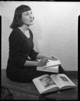 Georgina Thurber with books and notebook, 1941