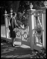 Eleanor Handy at gate in garden, [1940s?]
