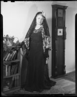 Mrs. Flournoy, in lace head scarf and lace dress, [1950s?]