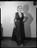 Woman in print dress, [1950s?]