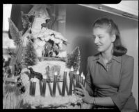 Betty Hanna with crèche, Santa Monica, 1941