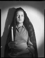 Betty Hanna in mantilla with candle, Santa Monica, 1941