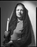 Betty Hanna in mantilla with candle, Santa Monica, 1941
